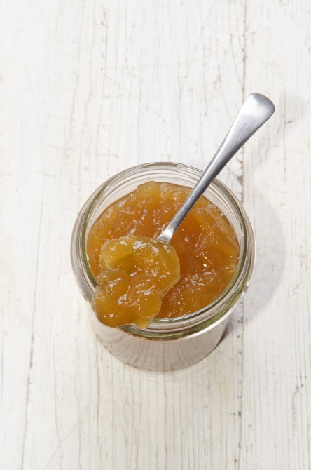 homemade apricot jam in a glass and spoon homemade apricot jam in a glass and spoon