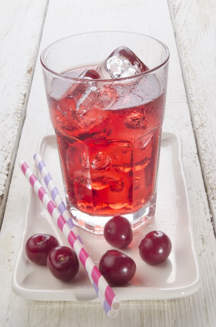 ice cold cherry juice and freshly washed cherries on a plate ice cold cherry juice and freshly washed cherries on a plate