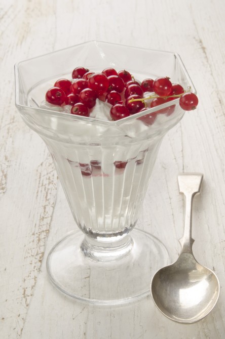 cold frozen yogurt with red currant in a glass