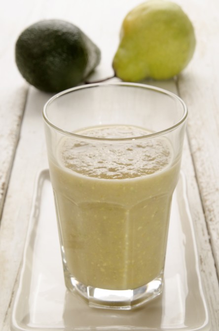 freshly made avocado and pear smoothie in a glass freshly made avocado and pear smoothie in a glass