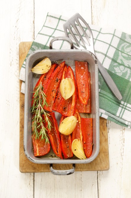 warm oven baked red paprika in olive oil with crushed pepper, onion and rosemary warm oven baked red paprika in olive oil with crushed pepper, onion and rosemary