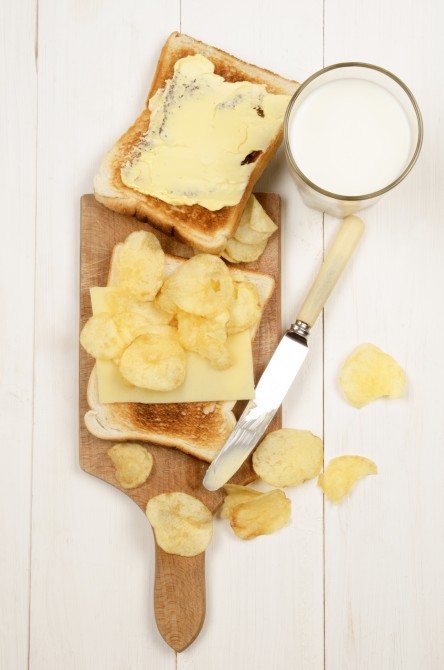 toast bread with a slice of mild irish cheddar, salted crisps and a glass of fresh milk toast bread with a slice of mild irish cheddar, salted crisps and a glass of fresh milk