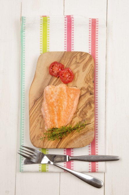 grilled salmon fillet with tomato and thyme on wooden board grilled salmon fillet with tomato and thyme on wooden board