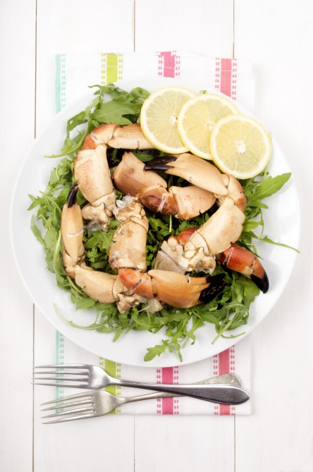 cooked crab claws with salad on a plate, read to eat cooked crab claws with salad on a plate, read to eat