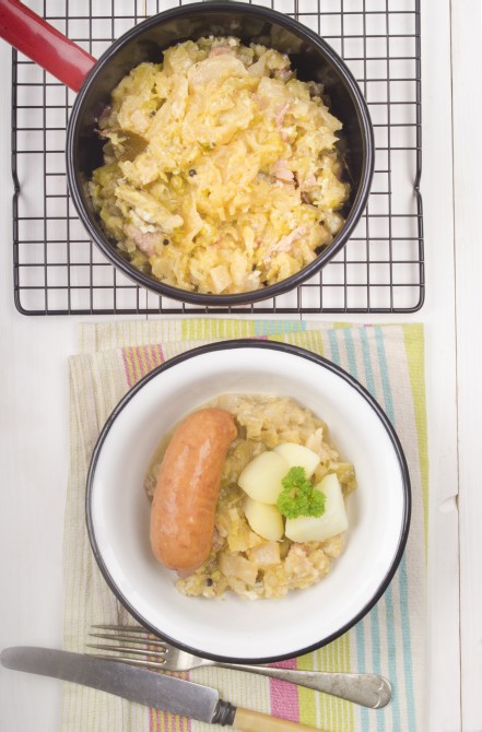 home made cabbage stew and sausage in a bowl