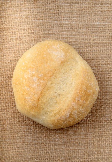 freshly baked bun on a hessian cloth