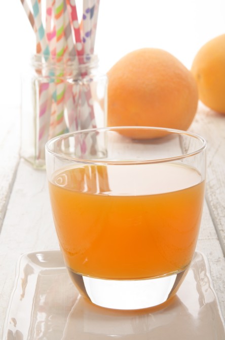 freshly squeezed cold orange juice in a glass freshly squeezed cold orange juice in a glass