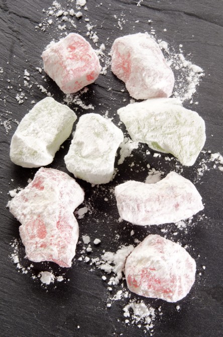 greek delight with powdered sugar on slate