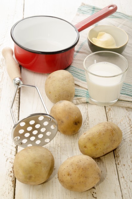 ingredients and kitchen tools to make mashed potatoes