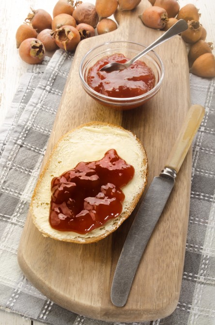 bread with butter and home made rose hip jelly bread with butter and home made rose hip jelly