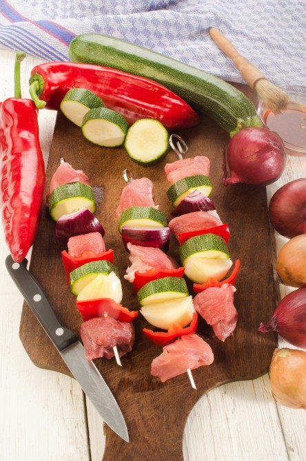 hungarian paprika skewers with pork, red pepper, lilac onion and courgette are prepared