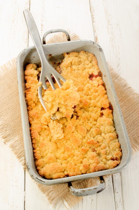home made sweet cherry crumble in a baking tin