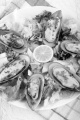 green lipped mussels from new zealand with salad and lemon on a plate