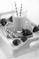 cold strawberry milkshake on a serving tray