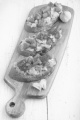 bruchetta with scrambled eggs, tomato, crushed pepper and garlic