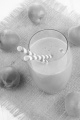 milkshake with straw and organic apricots on jute