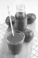 tomato juice with straw in a glass