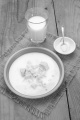 yeast in a bowl with warm milk and sugar on jute