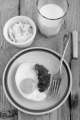 warm breakfast muffin with egg and parsley on a plate