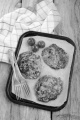 black pudding boxty on a tray with cherry tomato and fork