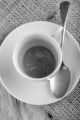 empty coffee cup with a spoon on jute
