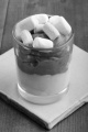 chocolate mascarpone dessert with whipped cream and marshmallow in a shot glass  
