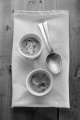 warm baked eggs with pepper in a ramekin and spoon