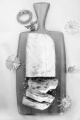 christmas marzipan stollen on wooden board