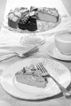 cake with chocolate curls on a plate and cup, coffee, milk froth