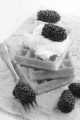 waffle with cream and blueberry on brown paper