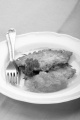 potato pancake with apricot jam and parsley on a plate