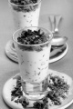yogurt with broken chocolate and sprinkles in a shot glass 