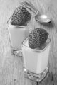 strawberry mousse and fruit in a shot glass on a rustic table