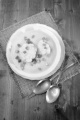 cauliflower soup with spring onions in deep dish