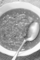 tomato soup with lentils, plate and spoon