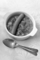 hot lentil soup with carrot and sausage in a bowl