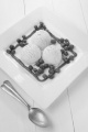 lemon ice cream, blueberries and fruit sauce on a white plate