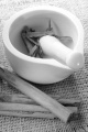 mortar and pestle with cinnamon on brown jute