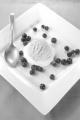 lemon ice cream on meringue and blueberries on a plate