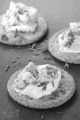 cracker on slate with stilton cheese and thyme
