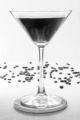 coffee liqueur in a martini glass and beans