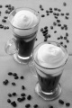 irish coffee in a glass and coffee beans