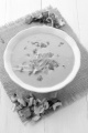 creamy vegetable soup in a bowl on jute