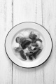 fresh summer salad with basil, tomato, red onion and cucumber on a enamel plate 