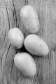 cleaned raw potato on a rustic table