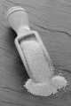dry yeast and wooden shovel on slate