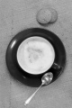 coffee with milk foam and biscuit on jute