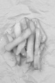 french fries with coarse salt on brown paper 
