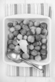 cooked brussels sprouts with butter in a bowl and spoon