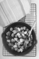 roasted brussels sprouts with apple in a cast iron pan